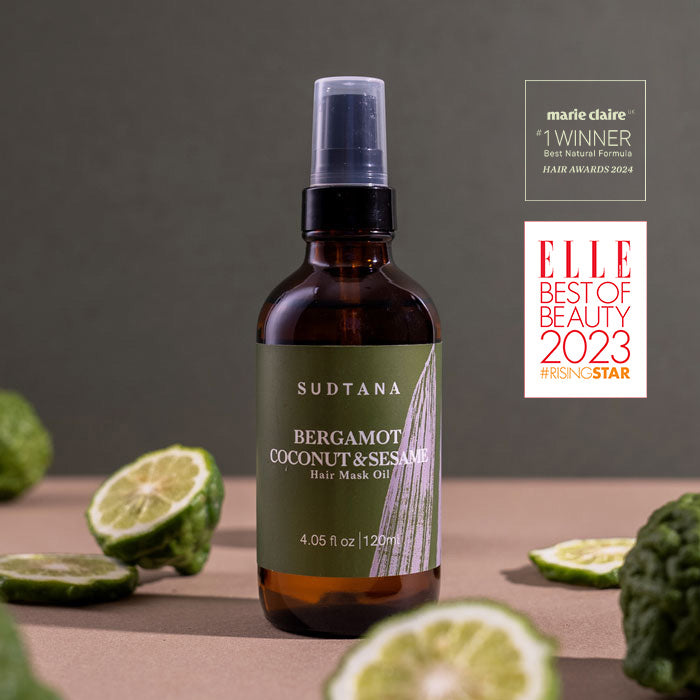 A bottle of the award-winning SUDTANA Bergamot Coconut & Sesame Hair Mask Oil, a natural nourishing oil blend for deep hair repair and shine.